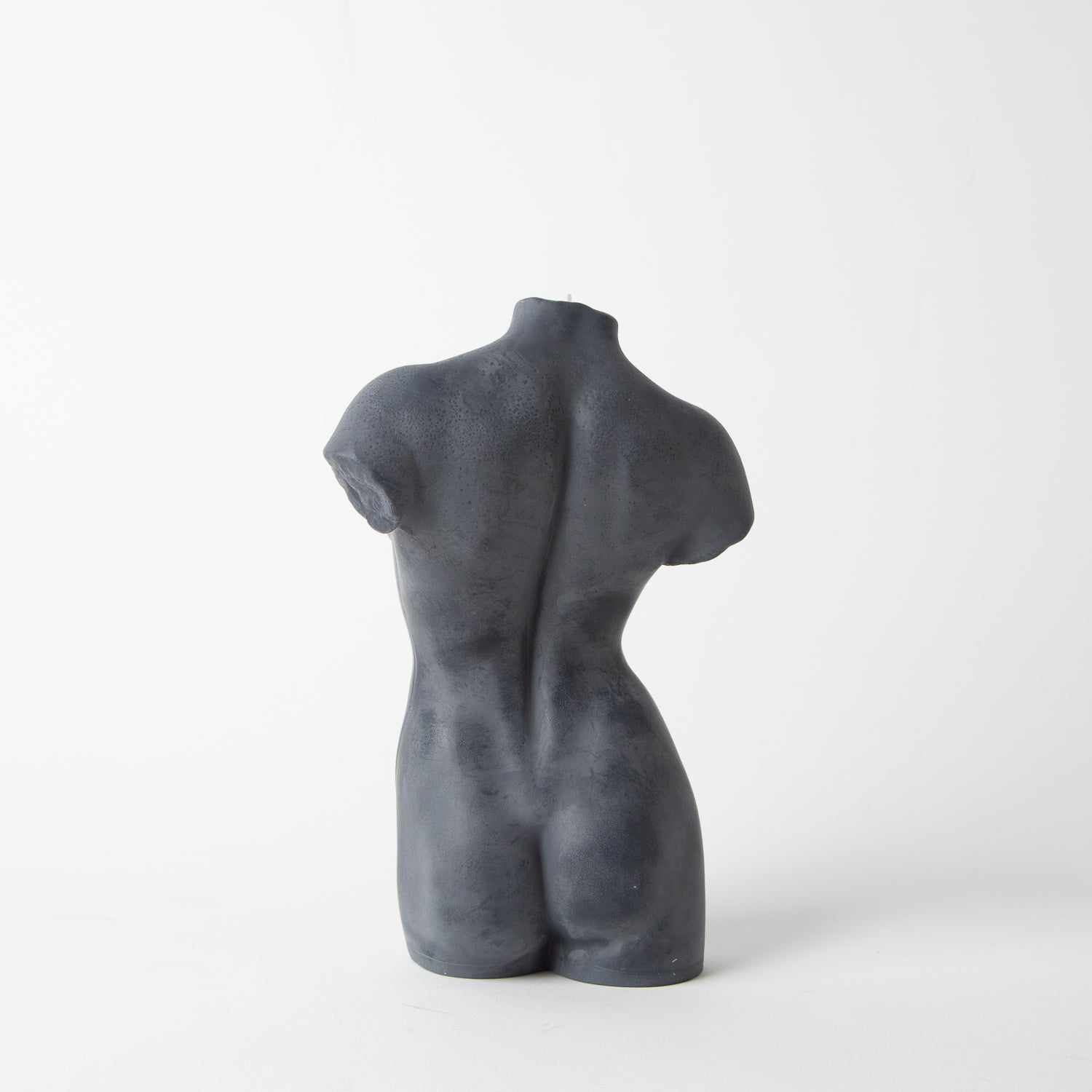 natural beeswax candle in black by hannah candle at secret location