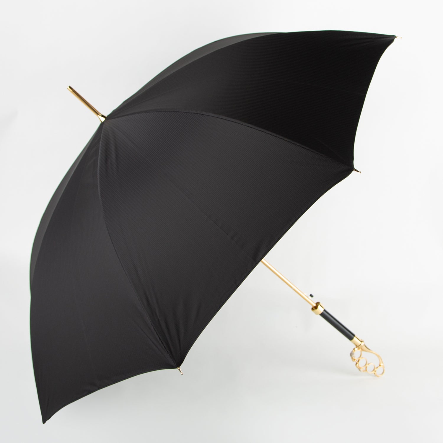 black umbrella with golden skull knuckleduster handle